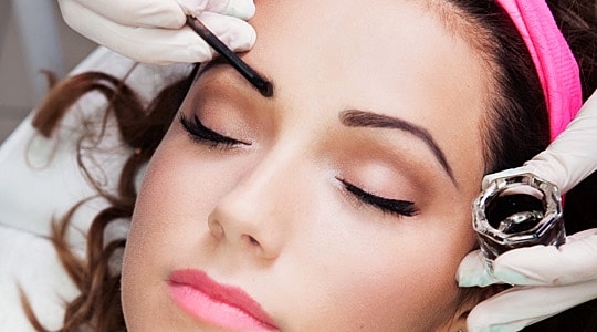 Roswell Eyebrow Tinting model receiving an eyebrow tint treatment at a medspa