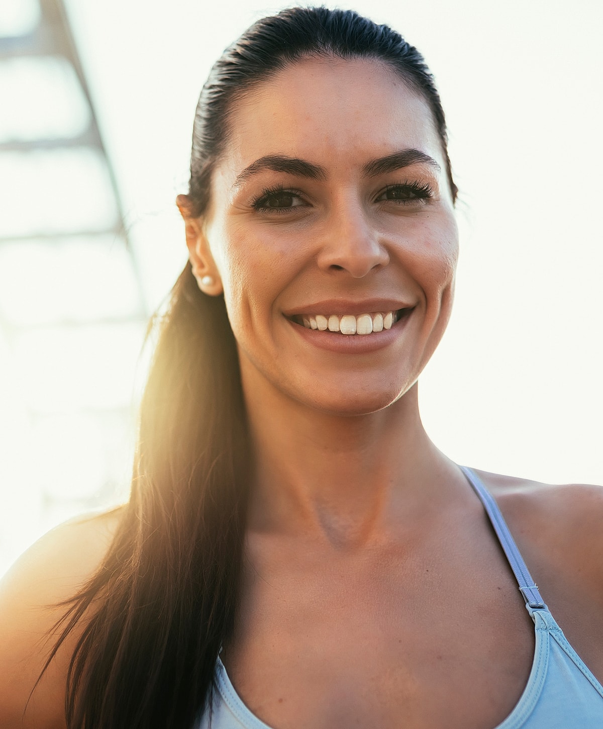 Roswell Wellness Tests model outdoors, sunlit background.