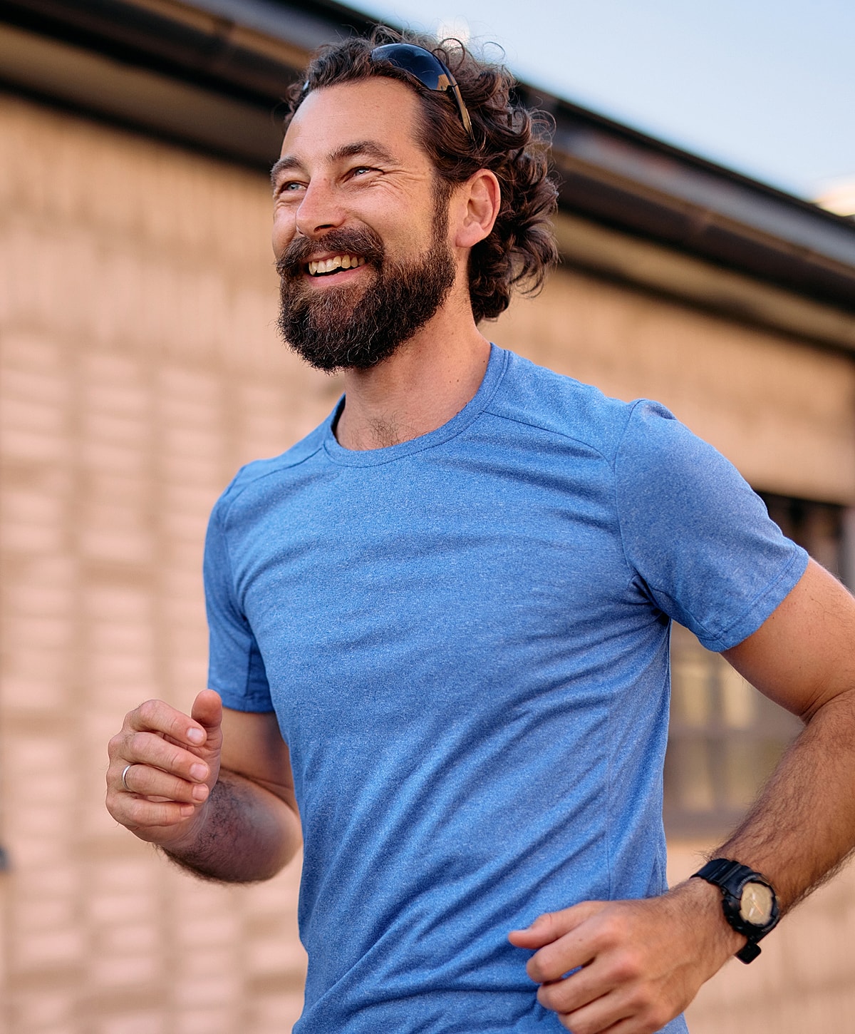 Roswell supplements model with a smile in blue shirt.