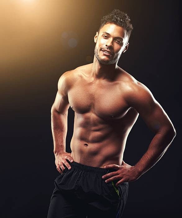 Roswell Men's services model posing against a dark background