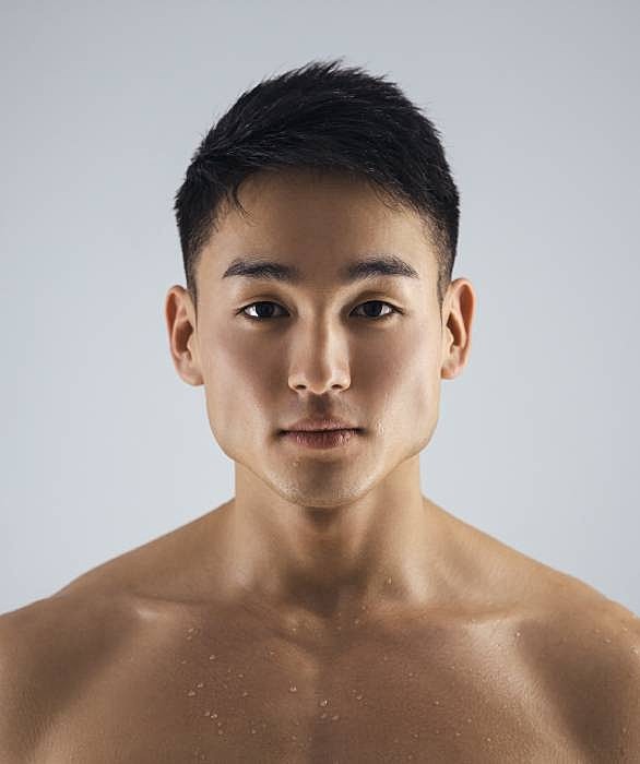 Roswell Men's services model with short hair.