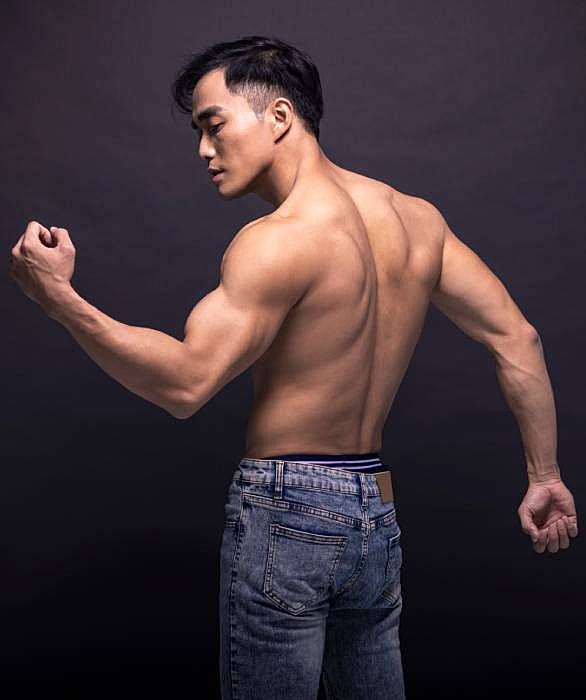 Roswell Men's services model posing in denim jeans.