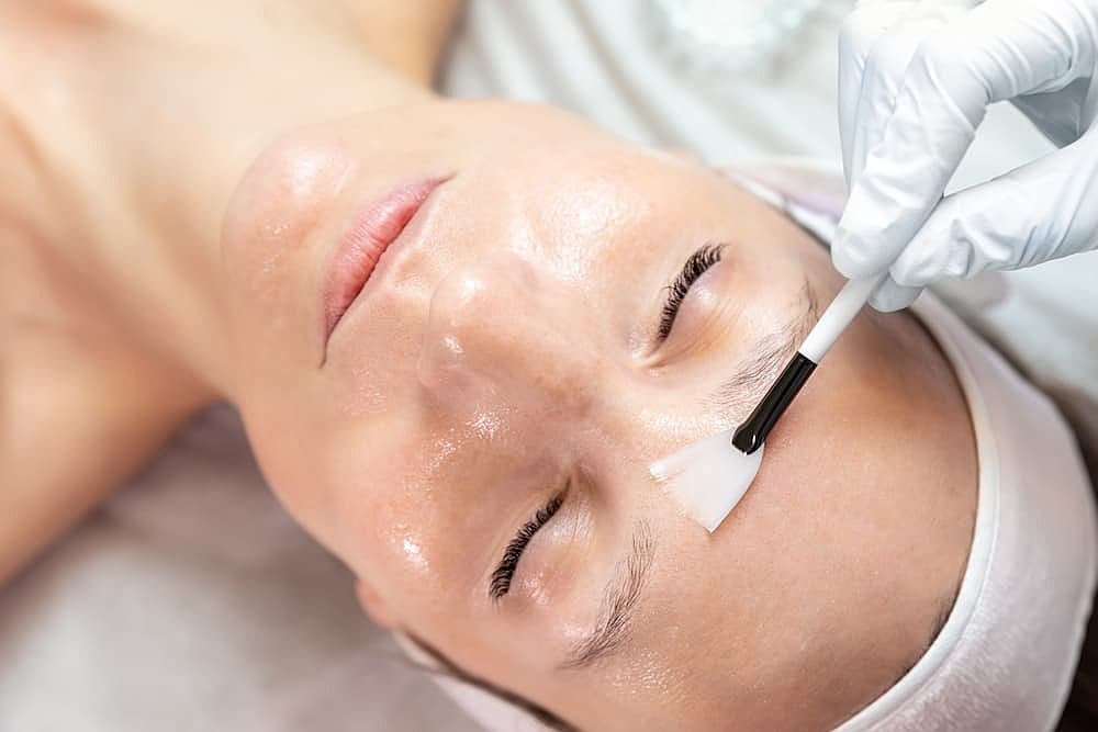 Facial treatment application on a relaxed client.
