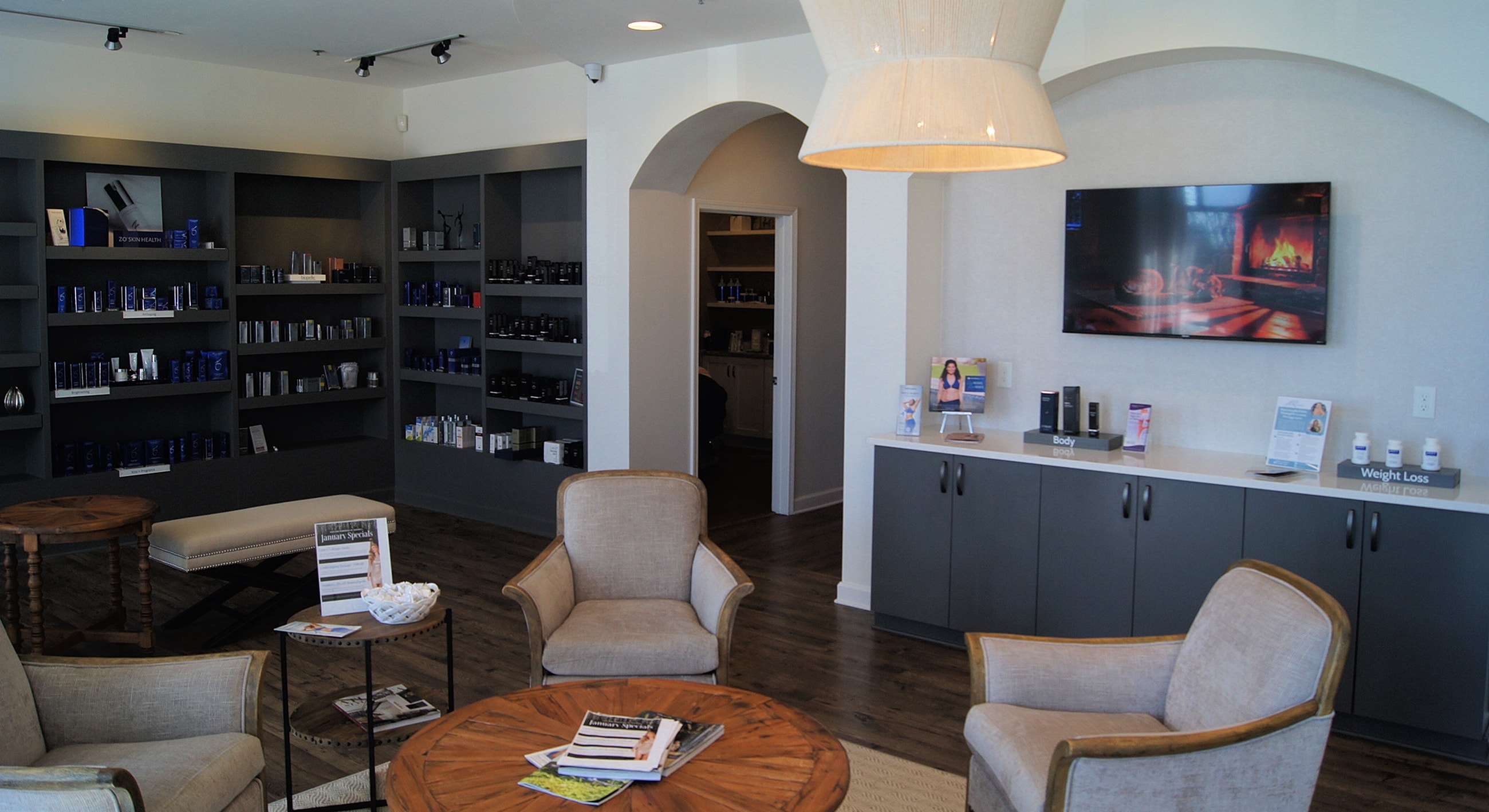 Modern aesthetic clinic interior with shelves products.